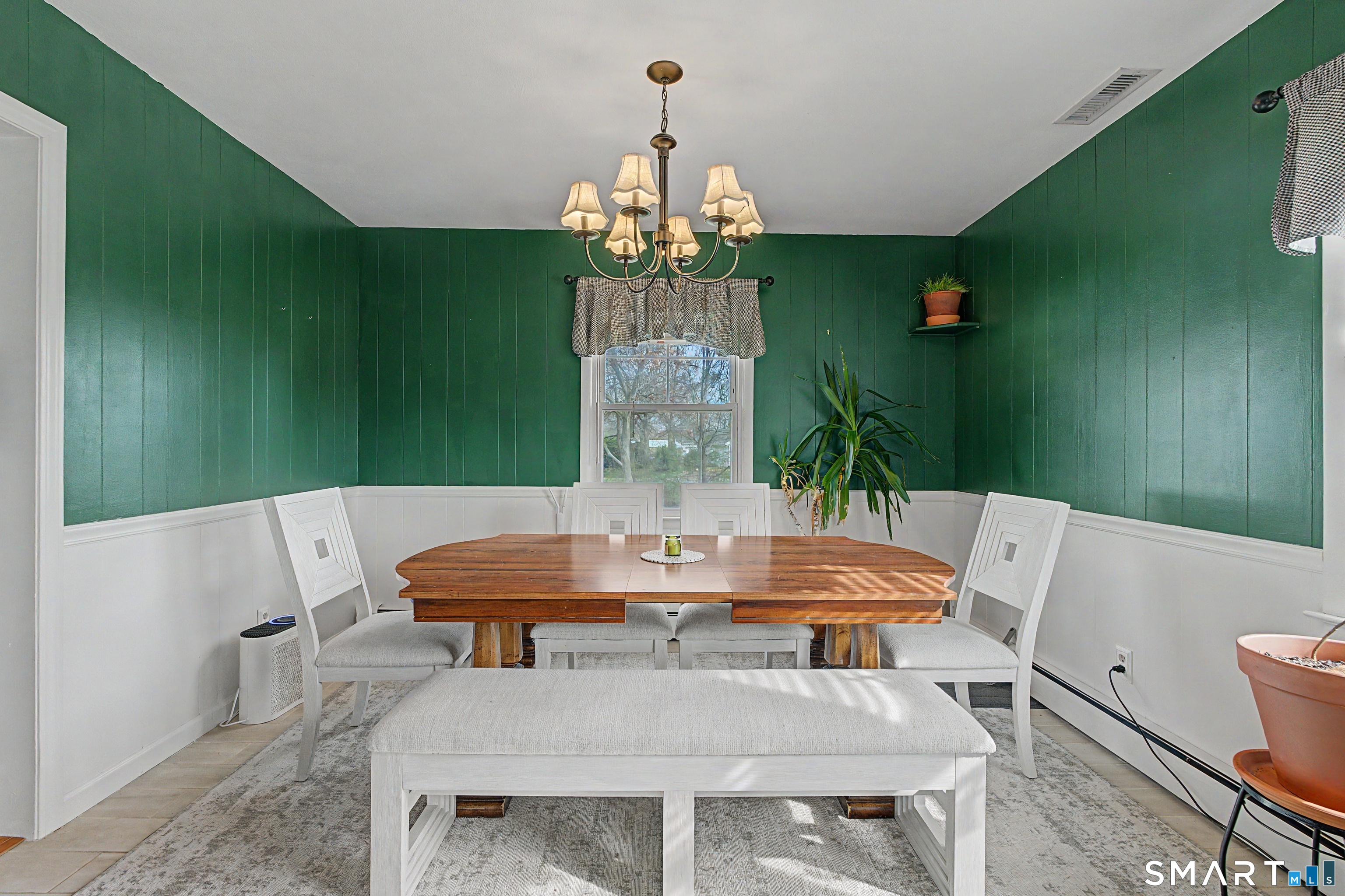 65 Jones Hill Road West Haven, CT 06516 - Photo 18 of 40 a view of a dining room with furniture and chandelier