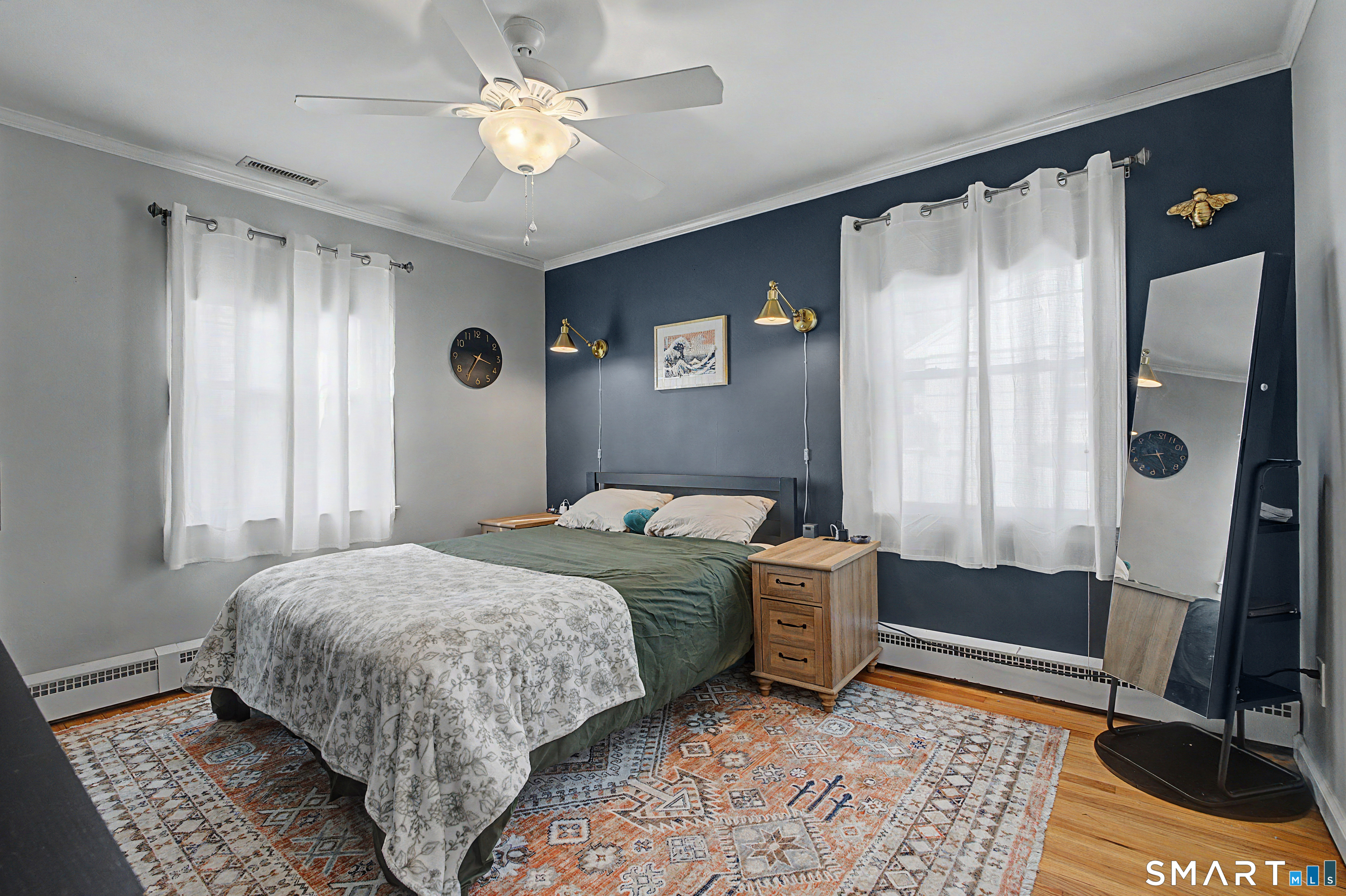 65 Jones Hill Road West Haven, CT 06516 - Photo 20 of 40 a bedroom with a bed and a chandelier