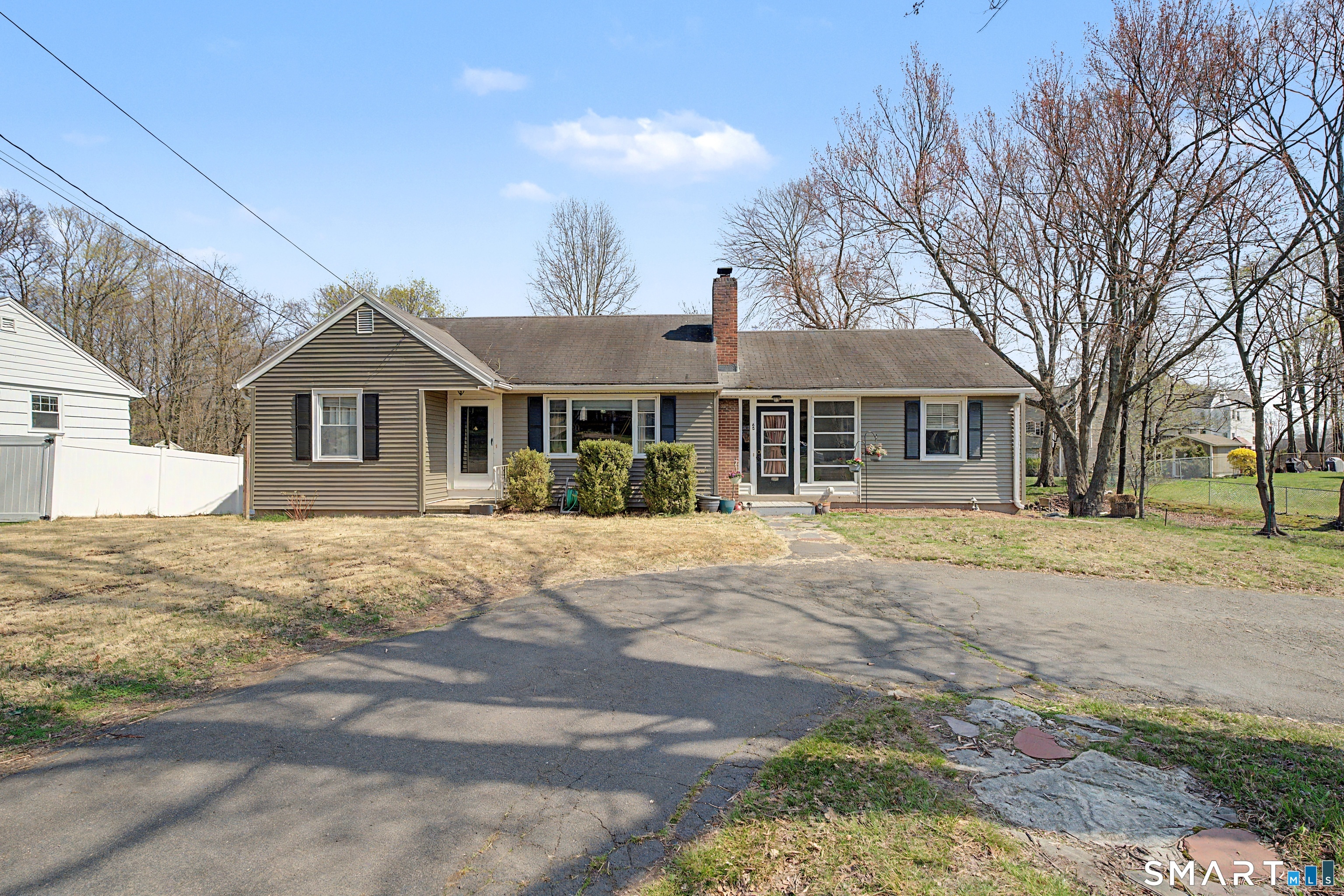 65 Jones Hill Road West Haven, CT 06516 - Photo 2 of 40 a front view of a house with a garden