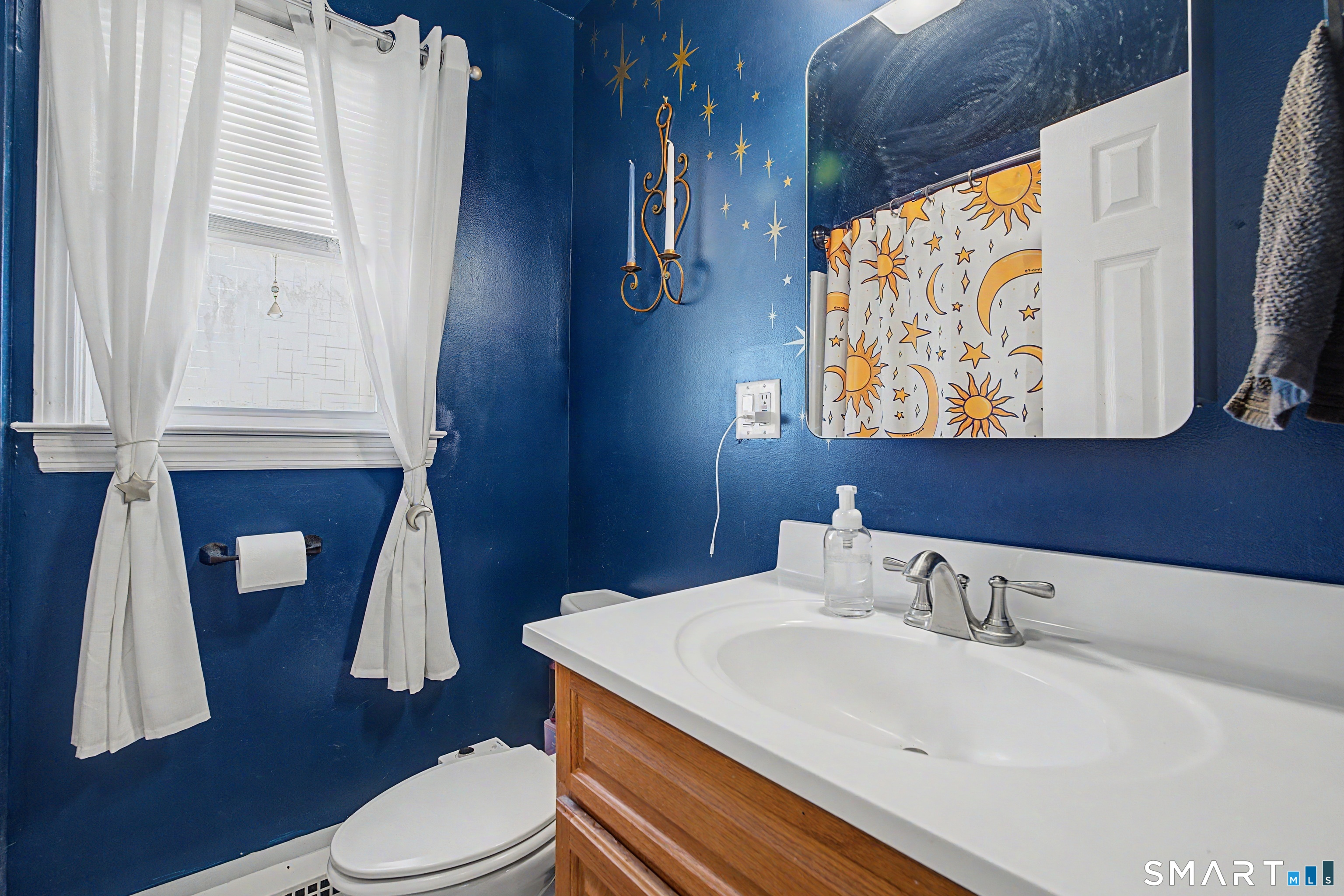 65 Jones Hill Road West Haven, CT 06516 - Photo 24 of 40 a bathroom with a sink toilet and mirror