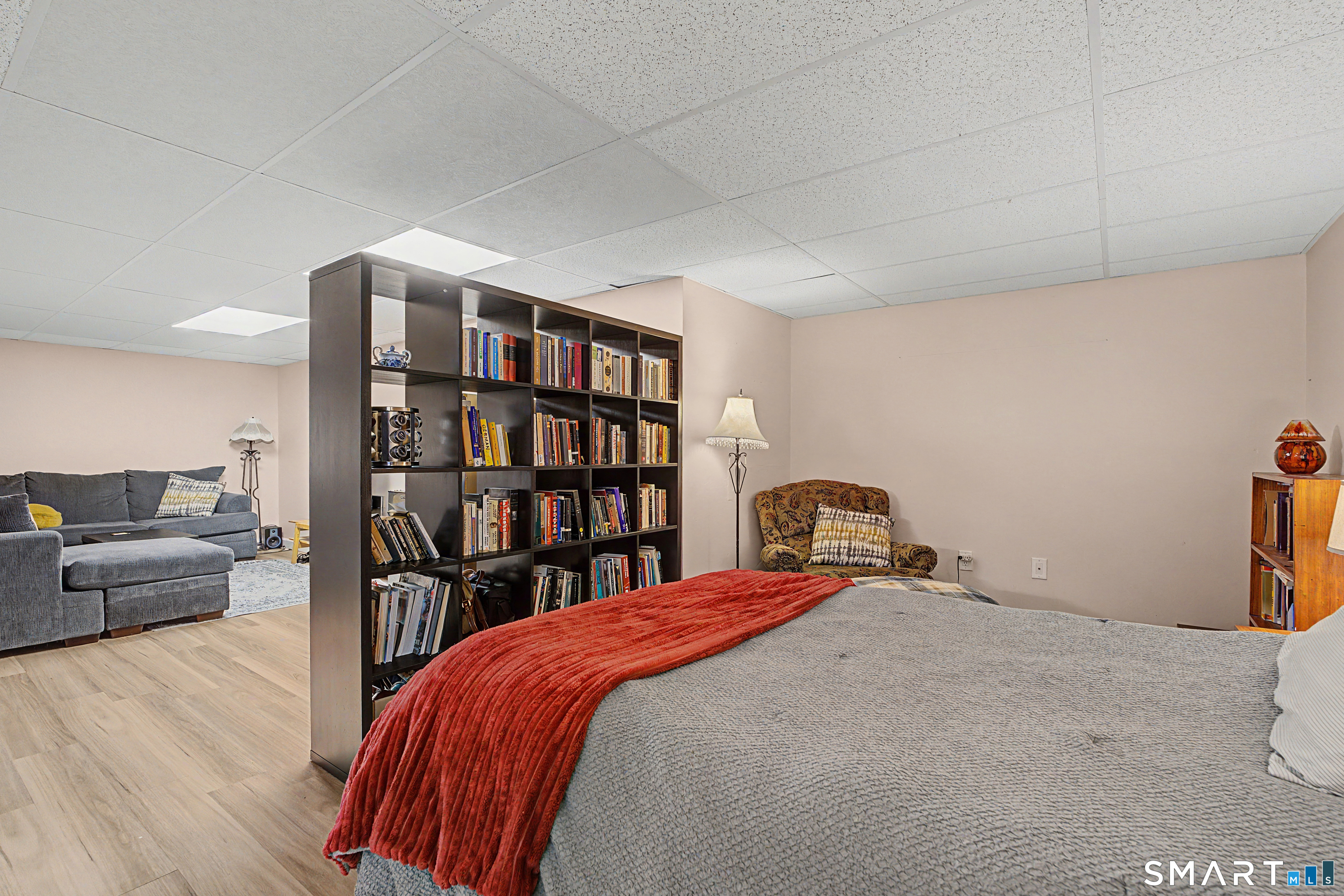 65 Jones Hill Road West Haven, CT 06516 - Photo 27 of 40 a bedroom with a bed and a book shelf