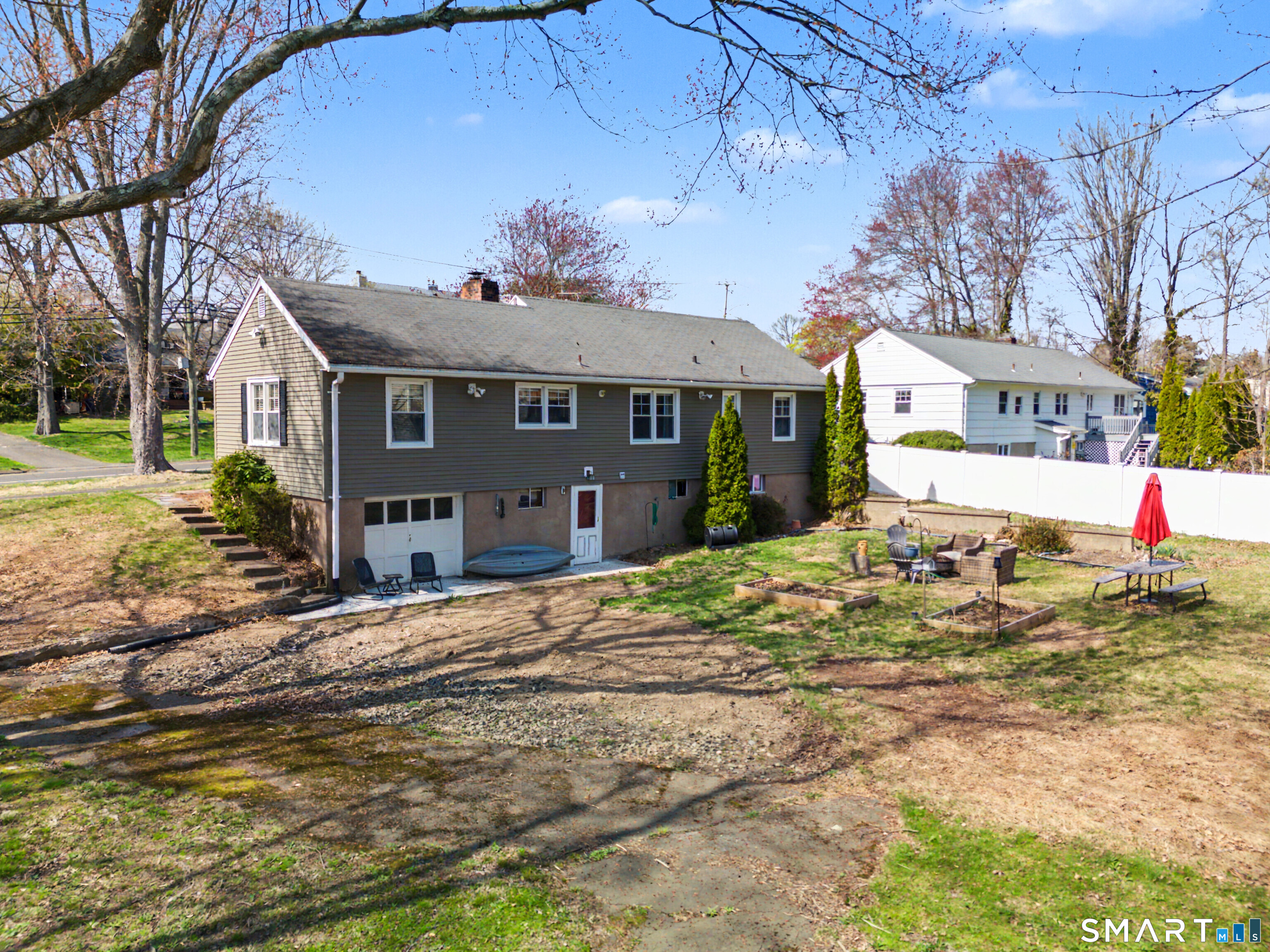 65 Jones Hill Road West Haven, CT 06516 - Photo 32 of 40 a front view of a house with a yard