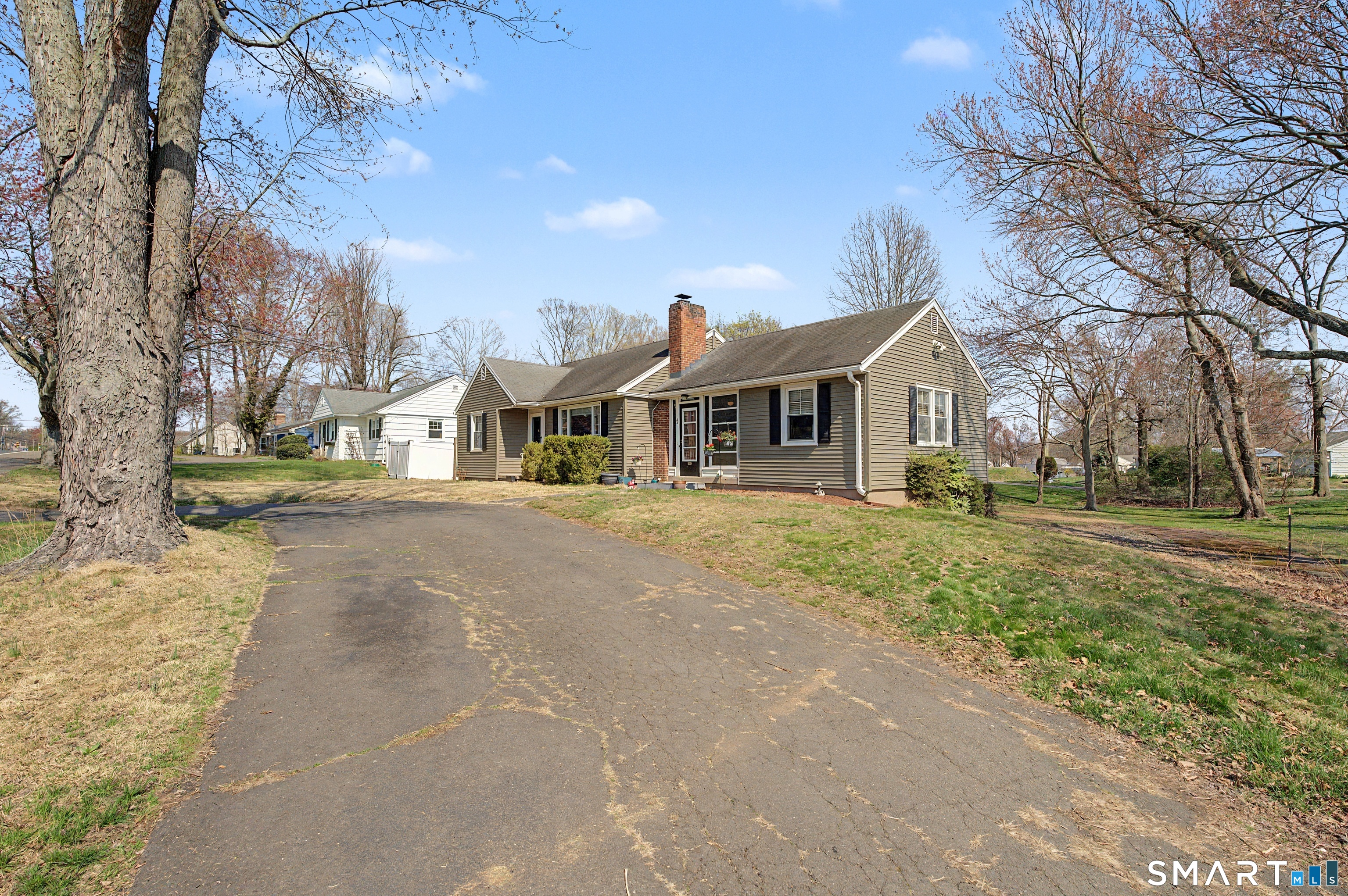 65 Jones Hill Road West Haven, CT 06516 - Photo 33 of 40 a front view of a house with a yard