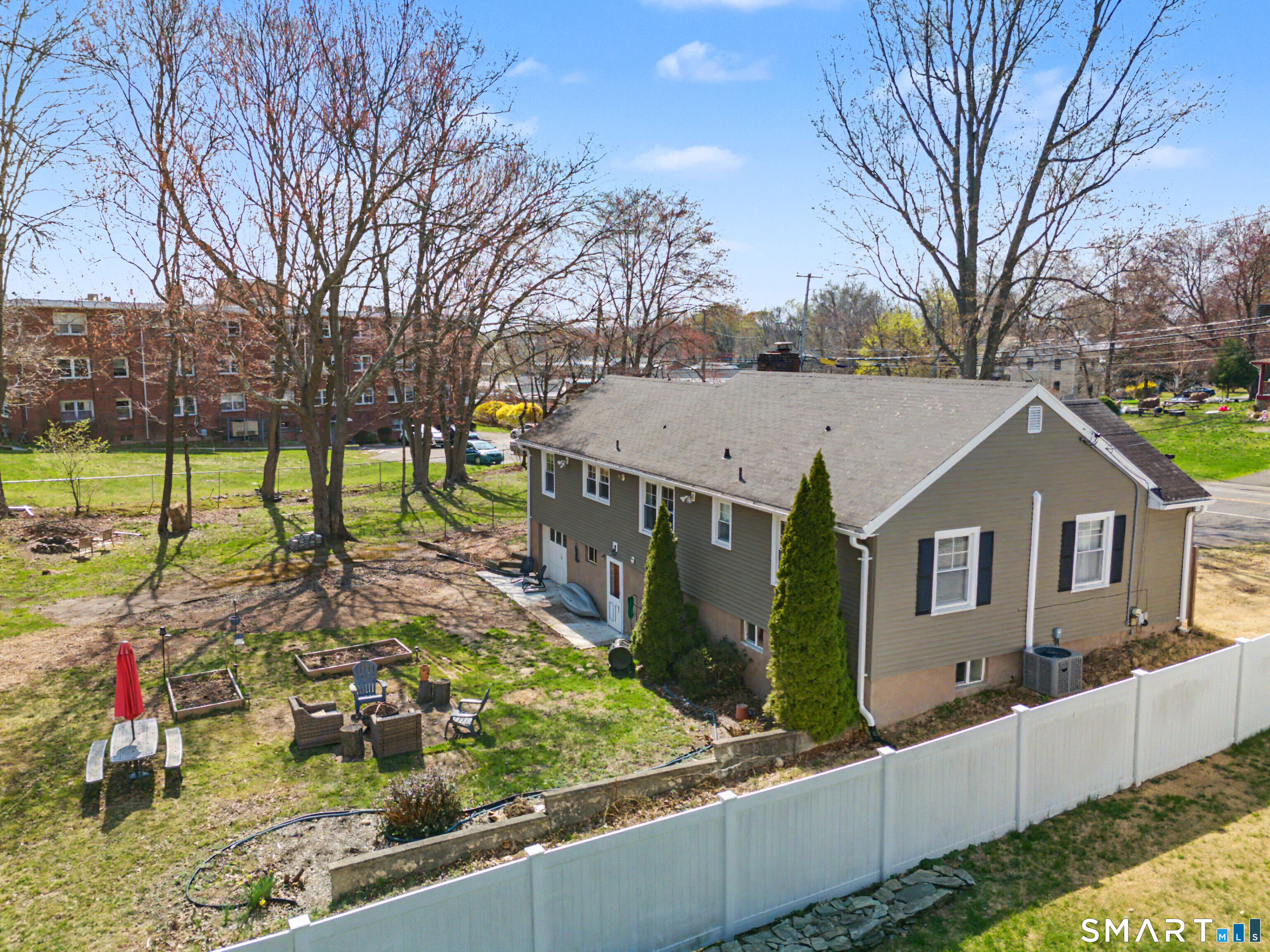 65 Jones Hill Road West Haven, CT 06516 - Photo 36 of 40 a view of a house with a yard