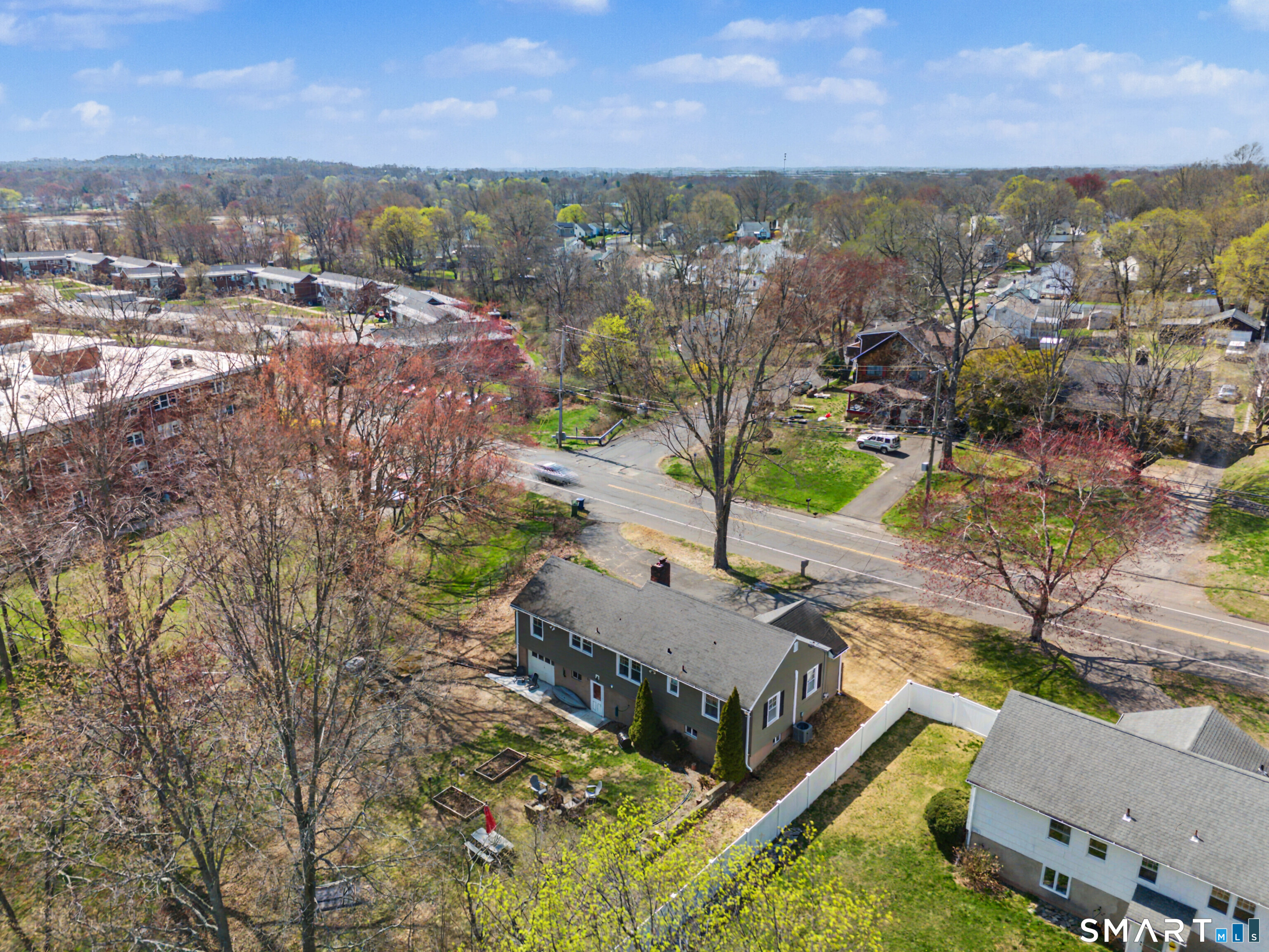 65 Jones Hill Road West Haven, CT 06516 - Photo 37 of 40 an aerial view of residential houses with outdoor space and trees