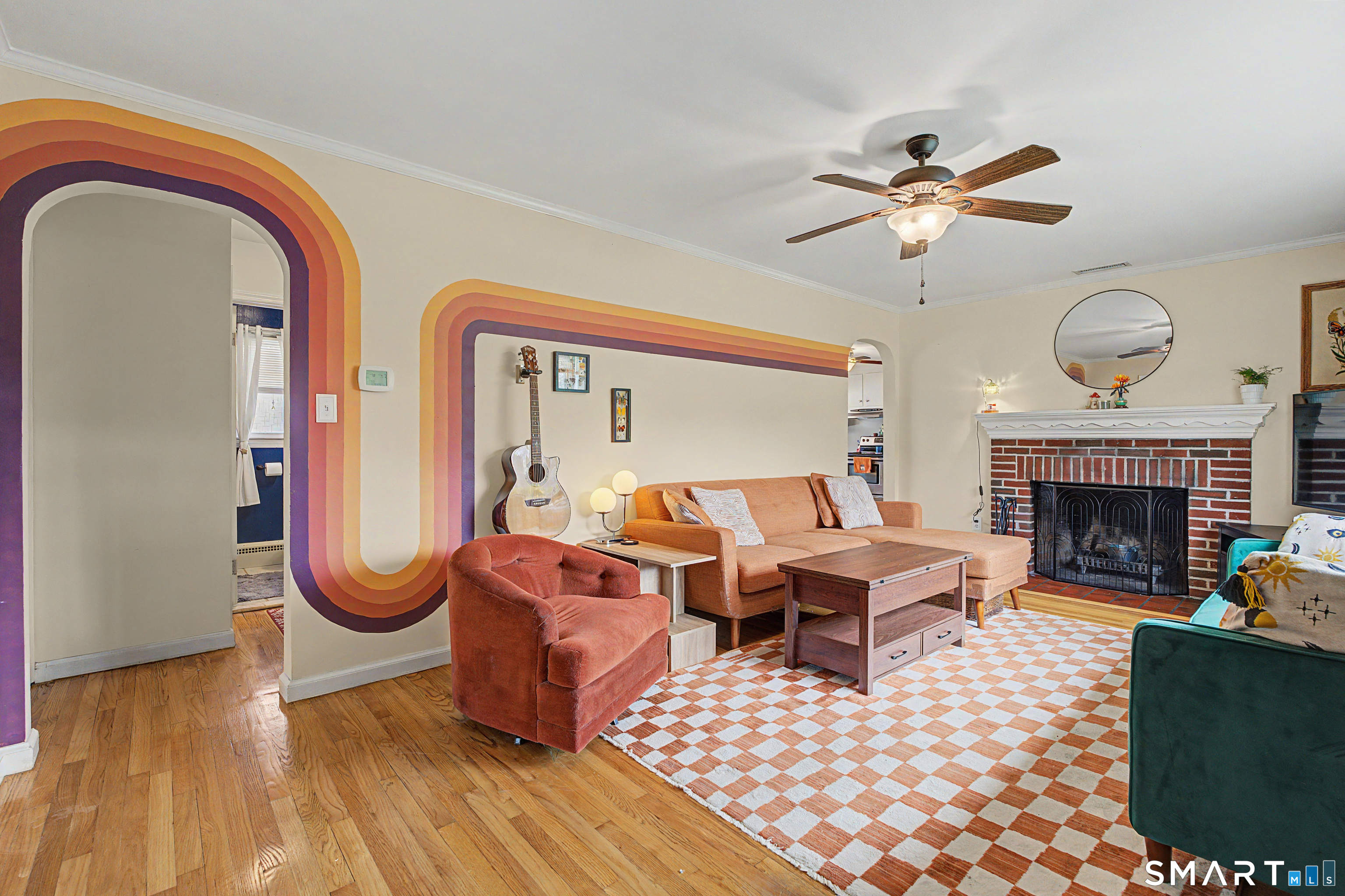 65 Jones Hill Road West Haven, CT 06516 - Photo 4 of 40 a living room with furniture a fireplace and a large window