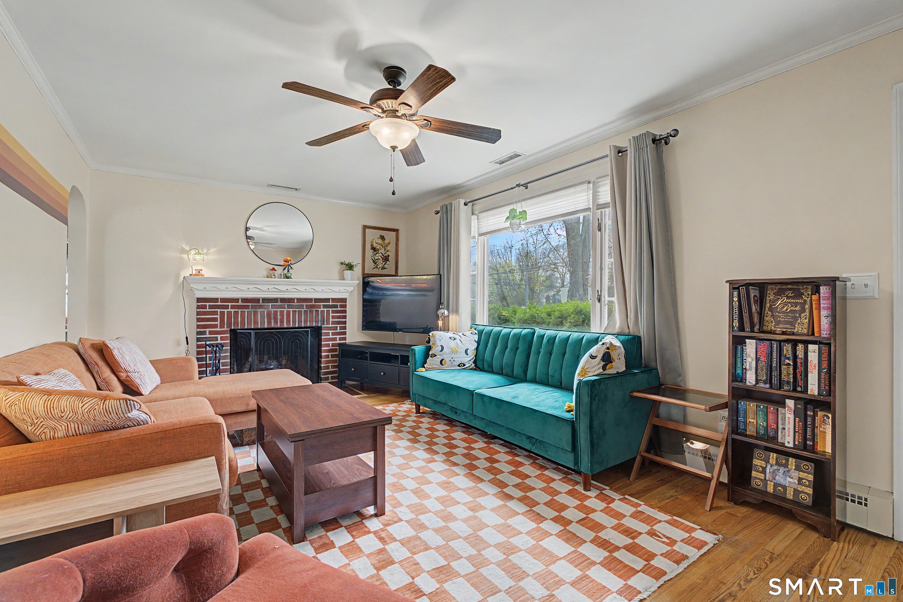 65 Jones Hill Road West Haven, CT 06516 - Photo 6 of 40 a living room with furniture a fireplace and a large window