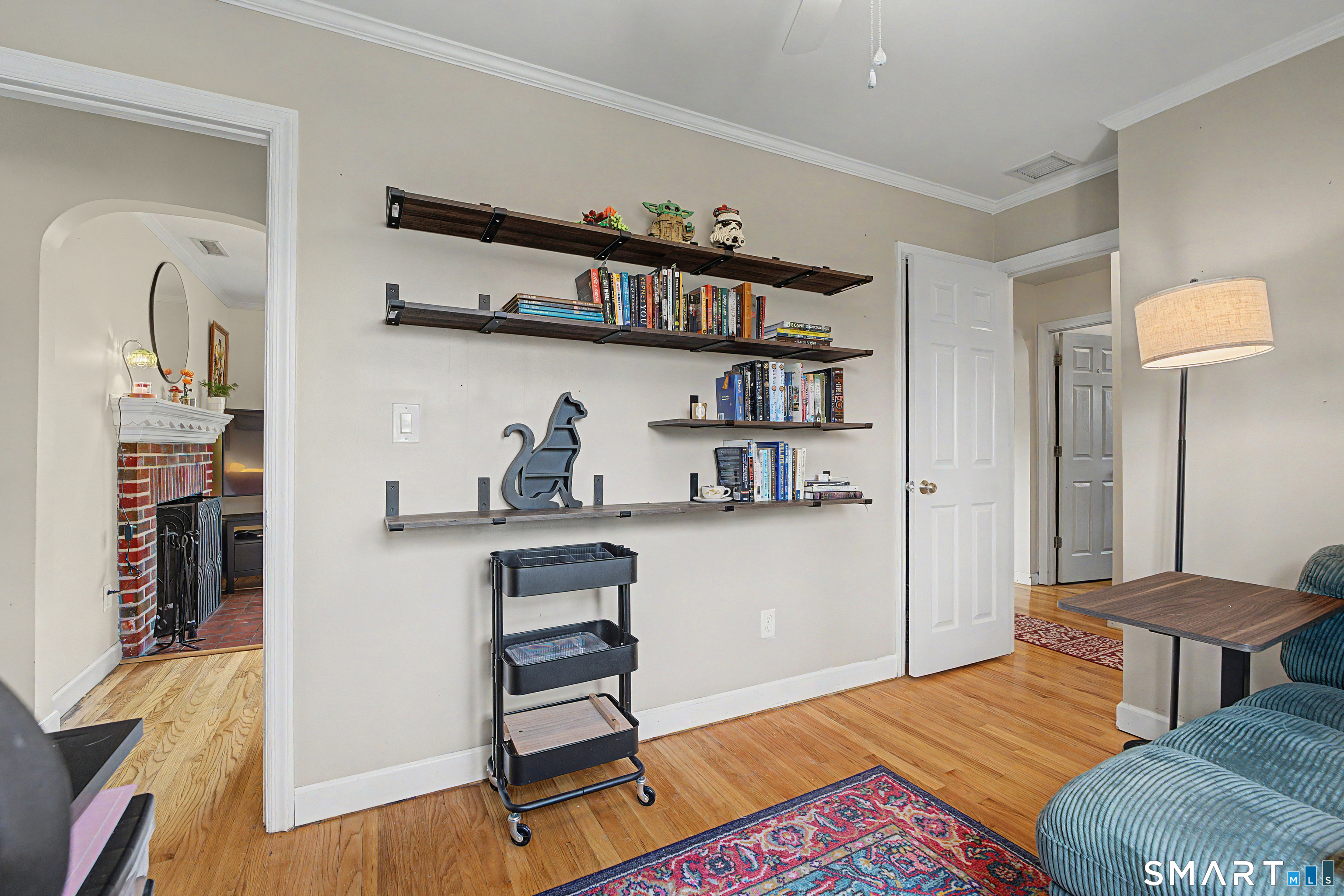 65 Jones Hill Road West Haven, CT 06516 - Photo 8 of 40 a bedroom with furniture and a book shelf