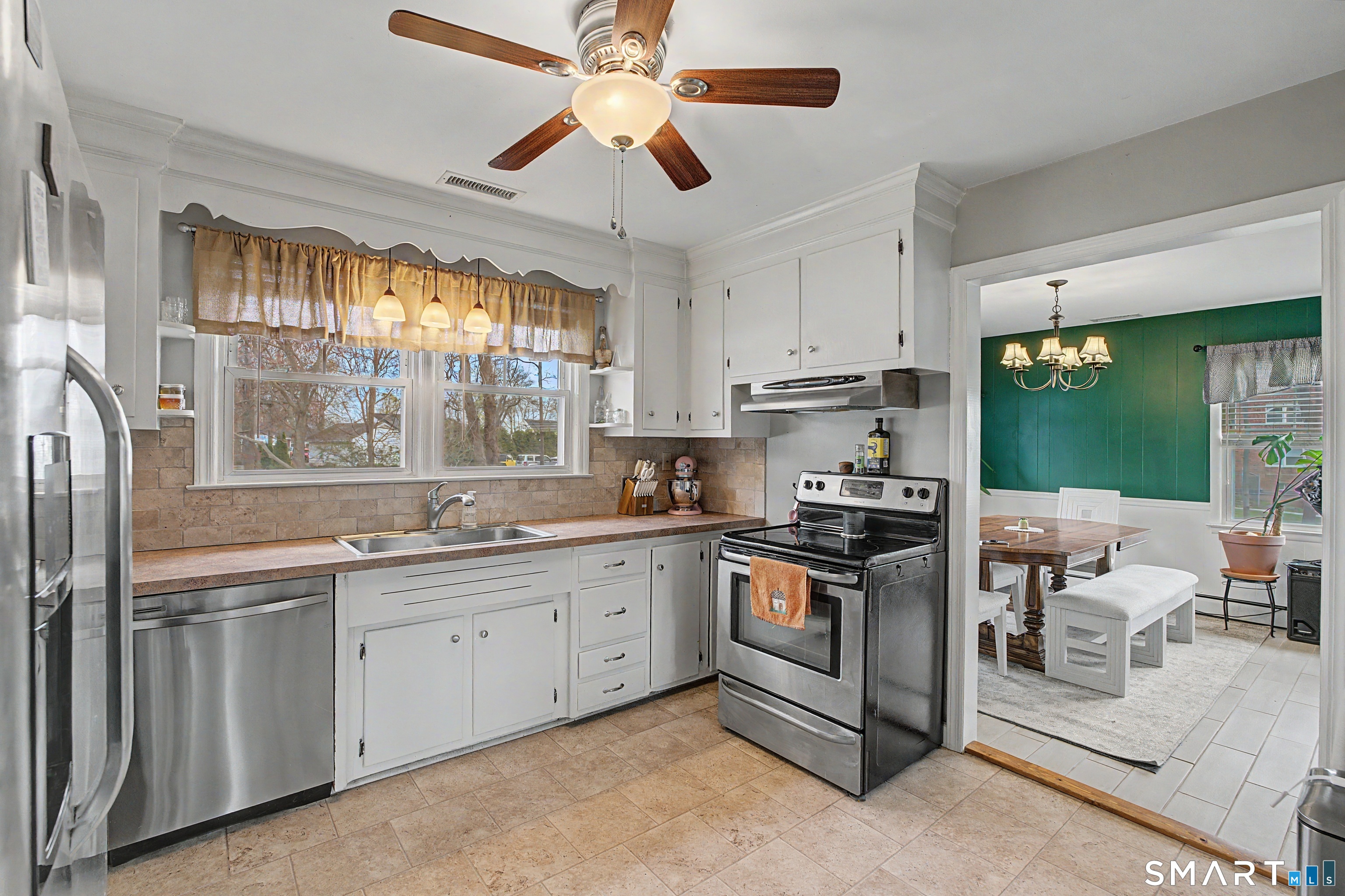 65 Jones Hill Road West Haven, CT 06516 - Photo 10 of 40 a kitchen with a sink stove and cabinets
