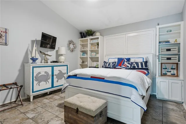 a bedroom with a bed and dresser