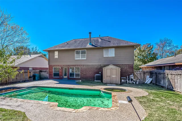 a front view of a house with a garden and plants