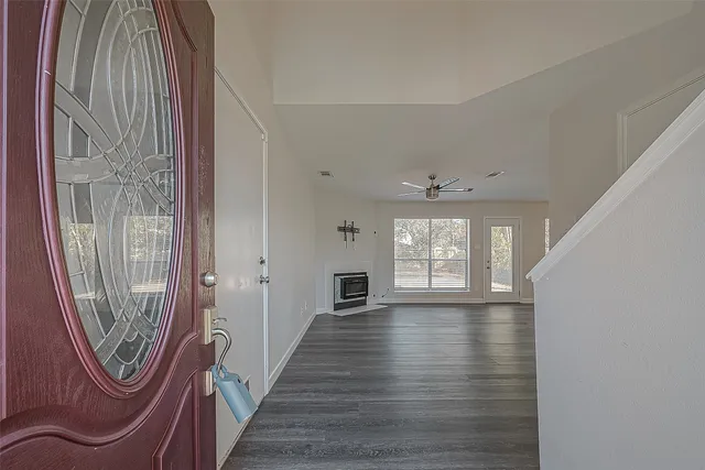 a view of an entryway with wooden floor