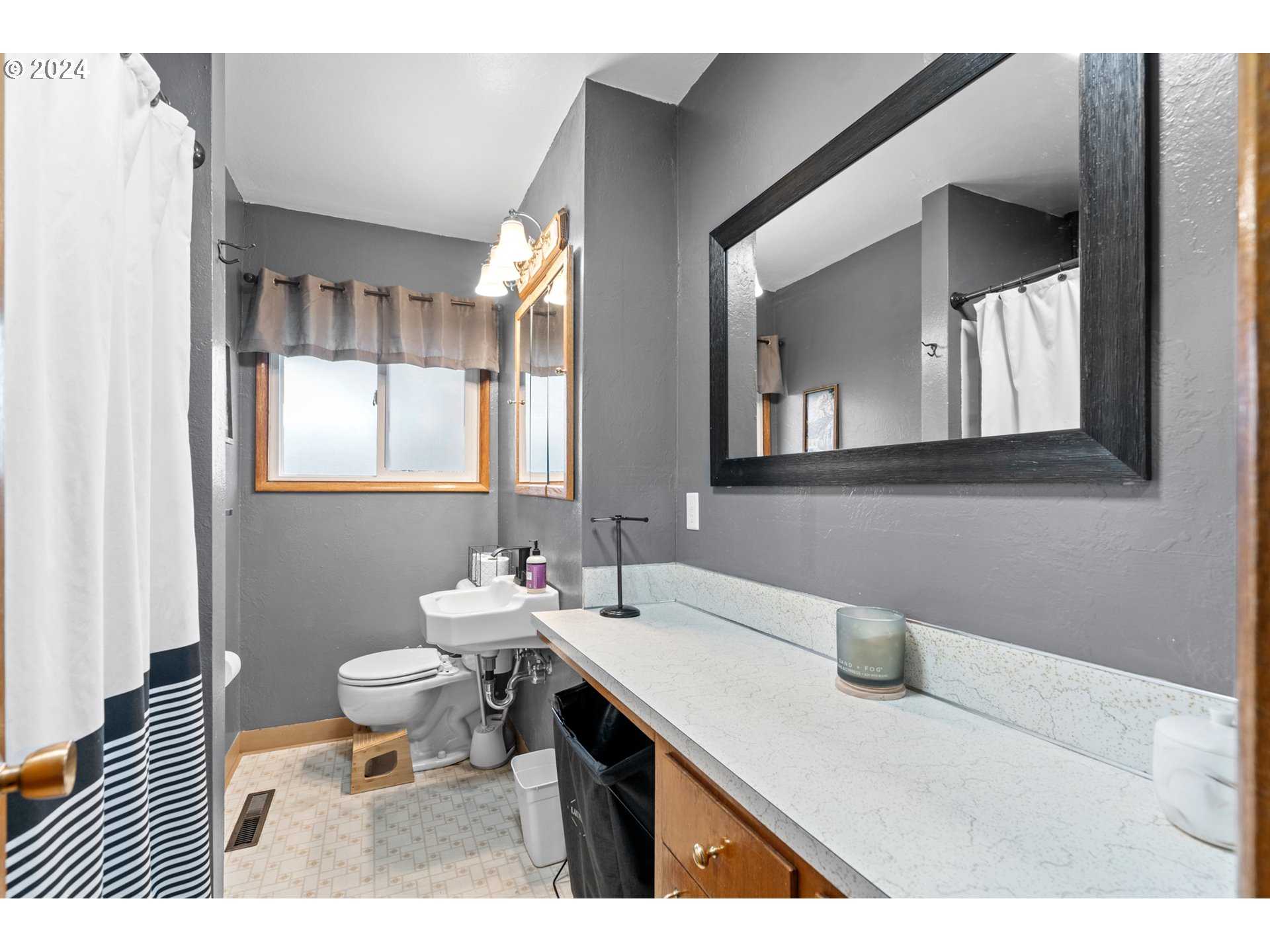 1338 Southwest 41st Street Pendleton, OR 97801 - Photo 15 of 40 a bathroom with a sink a toilet and mirror