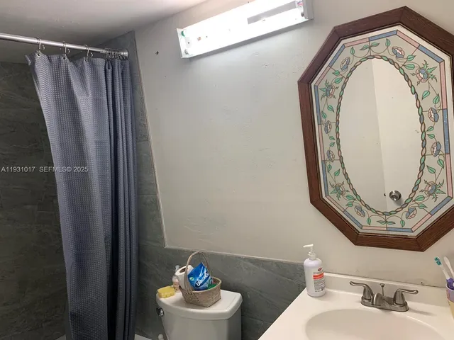 a bathroom with a toilet and a sink