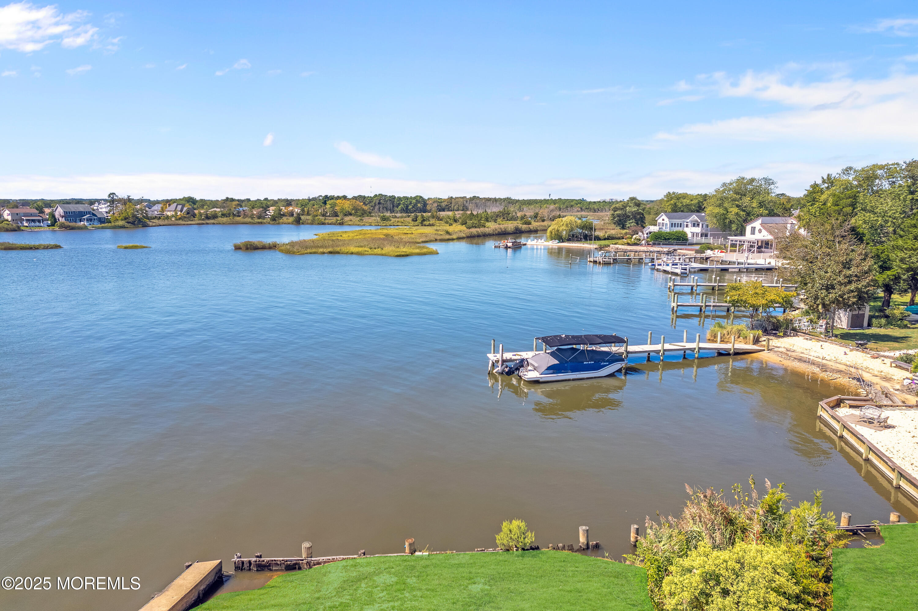 2 Cedar Tree Lane Toms River, NJ 08753 - Photo 10 of 37 a view of a lake with houses in the back