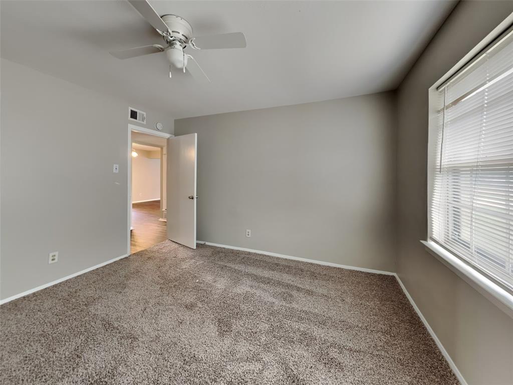 647 Rutgers Drive Lancaster, TX 75134 - Photo 12 of 23 wooden floor in an empty room with a window