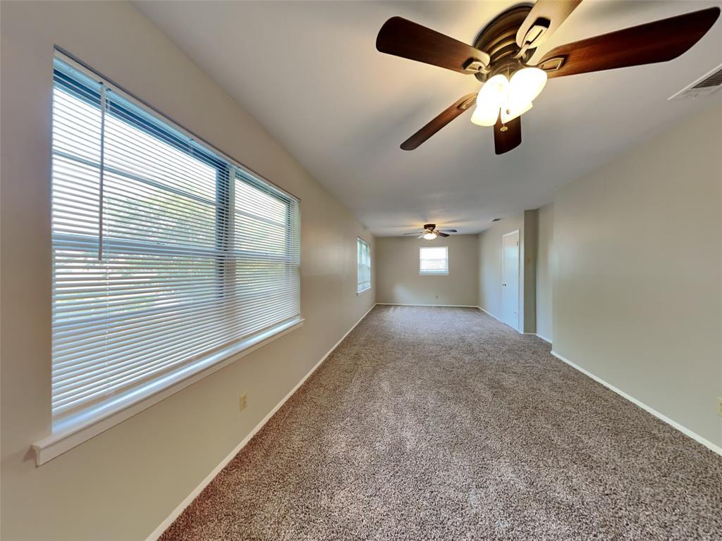 647 Rutgers Drive Lancaster, TX 75134 - Photo 8 of 23 a view of a livingroom with a ceiling fan and window