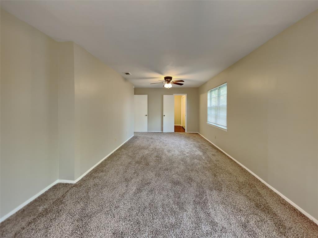 647 Rutgers Drive Lancaster, TX 75134 - Photo 9 of 23 a view of an empty room with a window