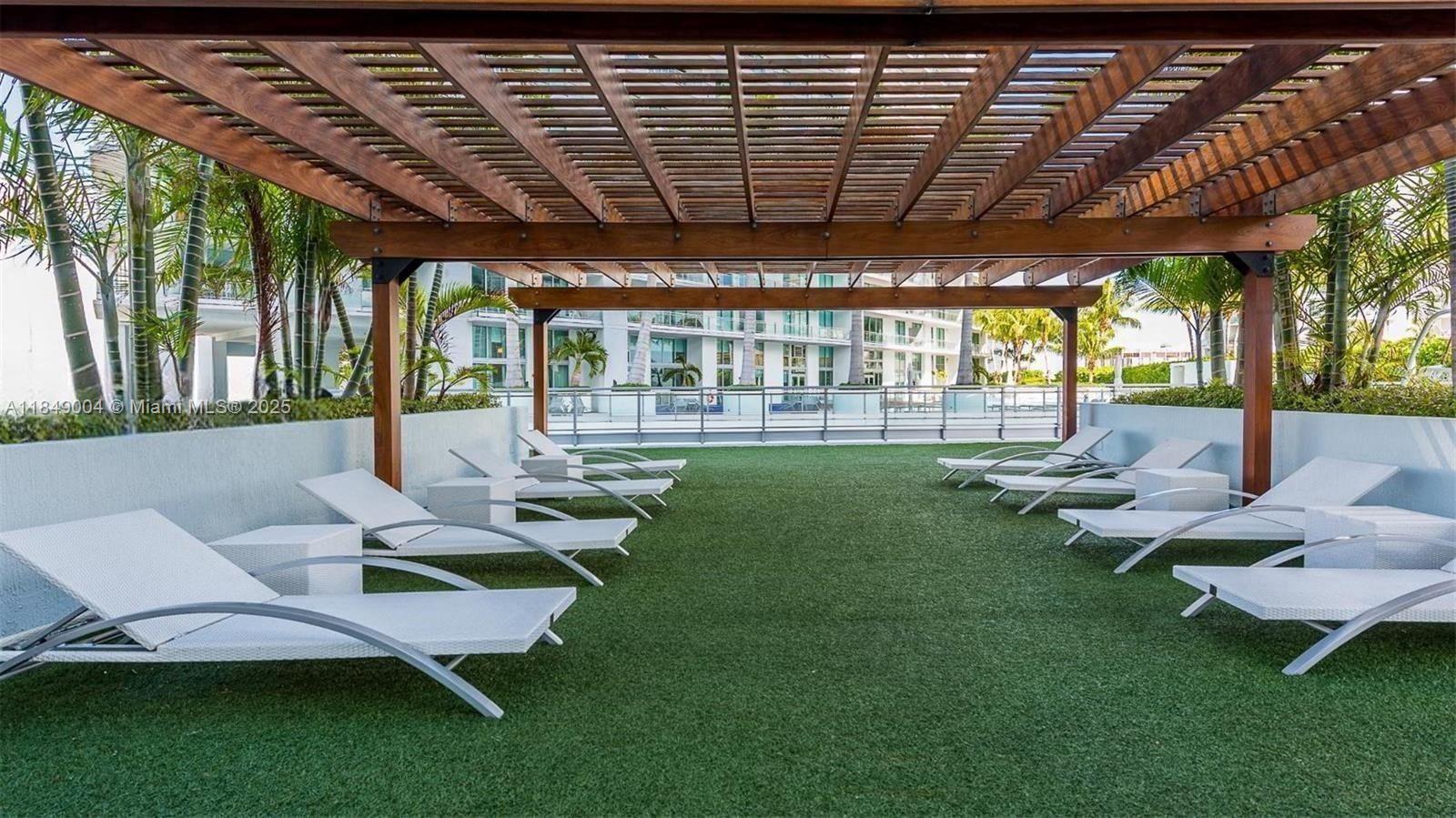 92 Southwest 3rd Street, Unit 3608 Miami, FL 33130 - Photo 21 of 24 a outdoor space with lots of white furniture