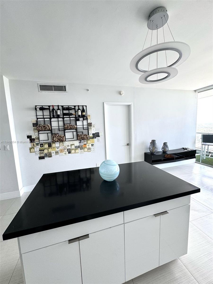 92 Southwest 3rd Street, Unit 3608 Miami, FL 33130 - Photo 8 of 24 a kitchen with a sink dishwasher and a stove