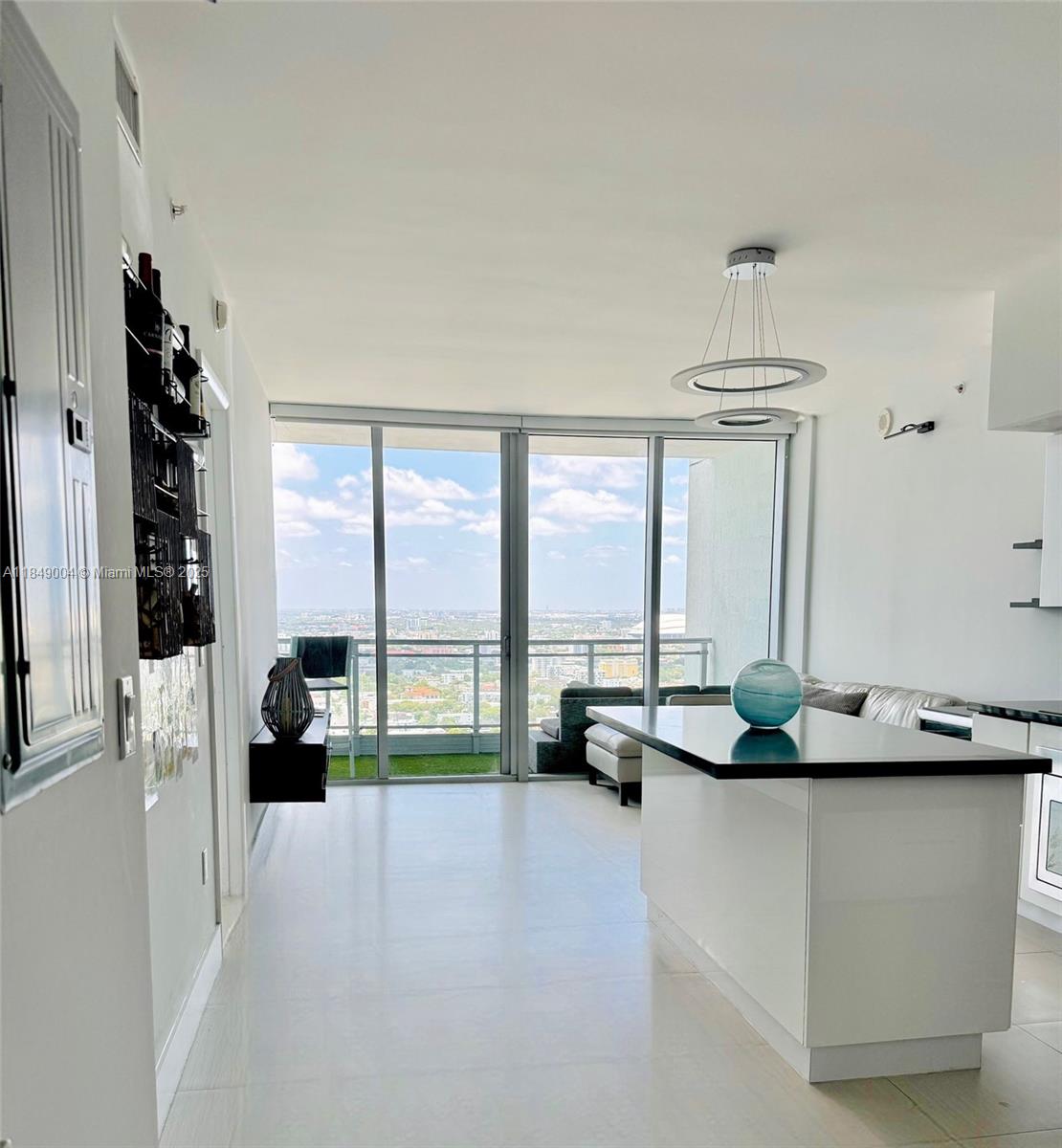 92 Southwest 3rd Street, Unit 3608 Miami, FL 33130 - Photo 10 of 24 a living room with furniture and a floor to ceiling window