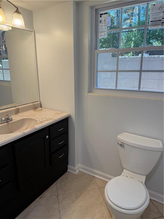 1309 Weston Drive Decatur, GA 30032 - Photo 12 of 35 a bathroom with a toilet sink and mirror