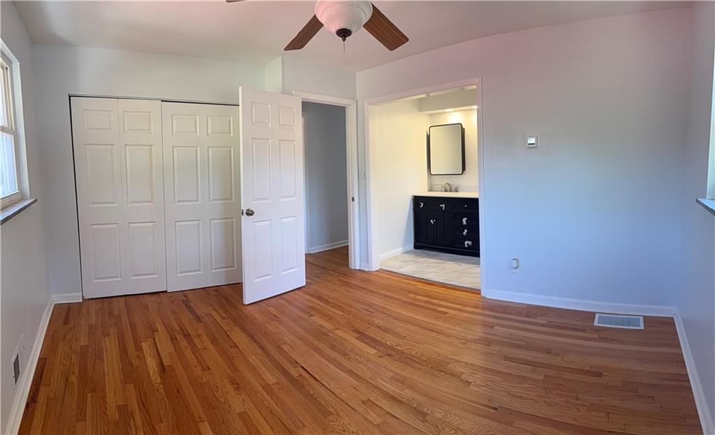 1309 Weston Drive Decatur, GA 30032 - Photo 24 of 35 wooden floor in an empty room with a window