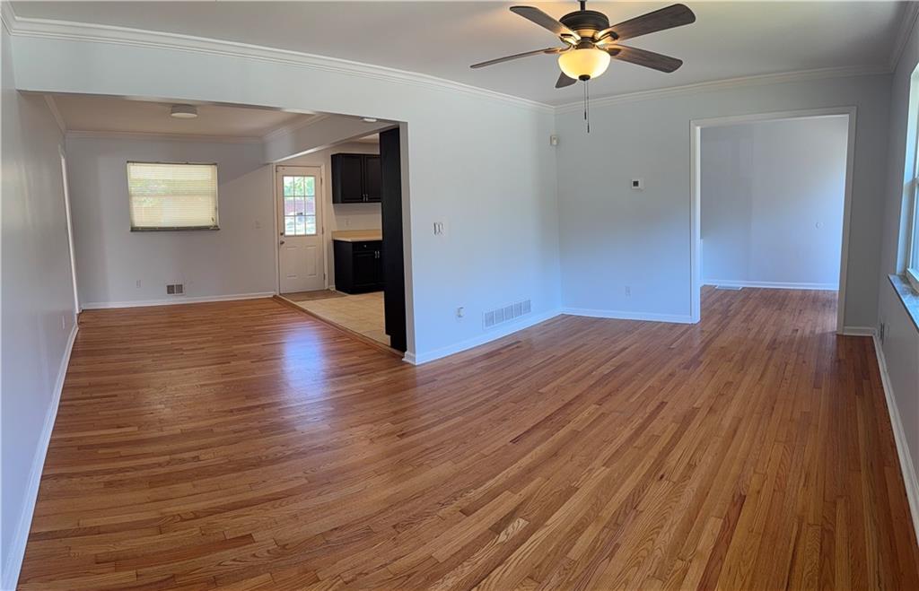 1309 Weston Drive Decatur, GA 30032 - Photo 28 of 35 a view of a livingroom with a hardwood floor and a ceiling fan