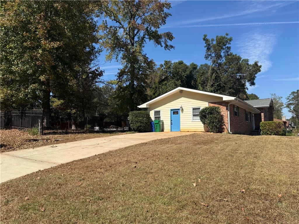 1309 Weston Drive Decatur, GA 30032 - Photo 3 of 35 a front view of a house with a yard