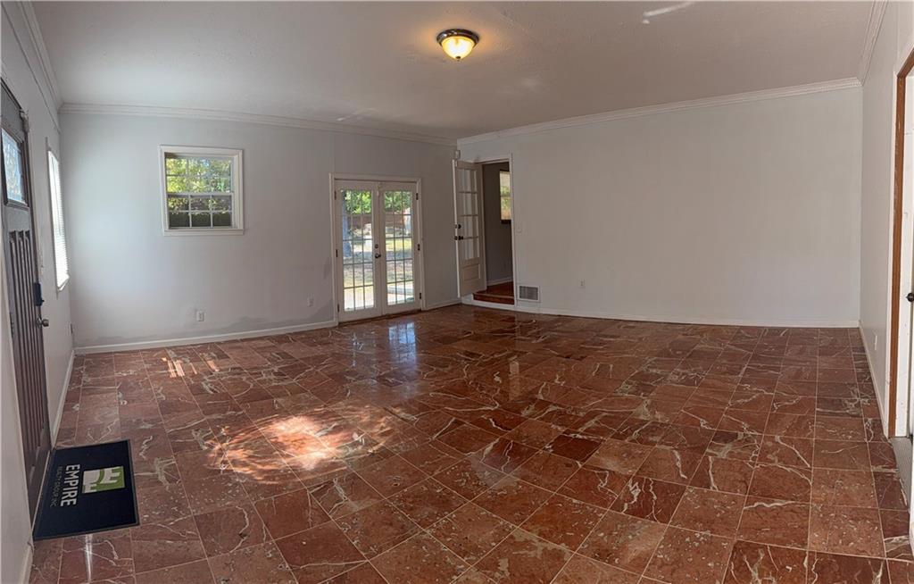 1309 Weston Drive Decatur, GA 30032 - Photo 33 of 35 a view of an empty room with window and wooden floor