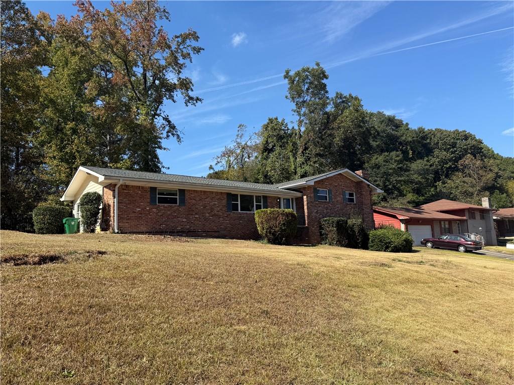 1309 Weston Drive Decatur, GA 30032 - Photo 4 of 35 a front view of a house with a yard