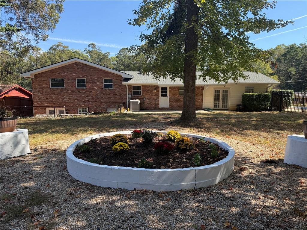 1309 Weston Drive Decatur, GA 30032 - Photo 8 of 35 a view of a house with swimming pool and a yard