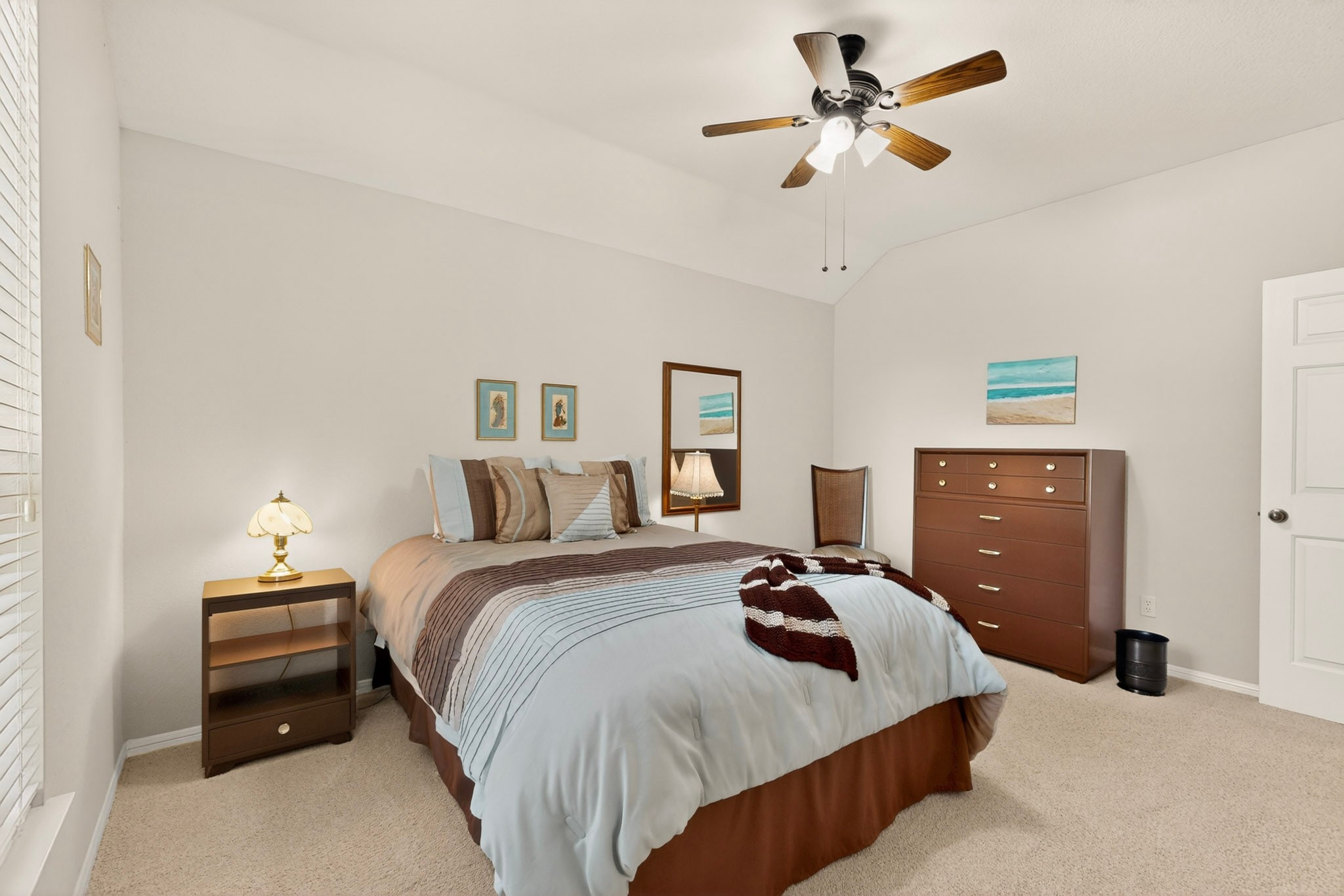 905 Victoria Ridge Drive Pflugerville, TX 78660 - Photo 24 of 32 Relax in this tranquil bedroom, featuring a detailed vaulted ceiling.