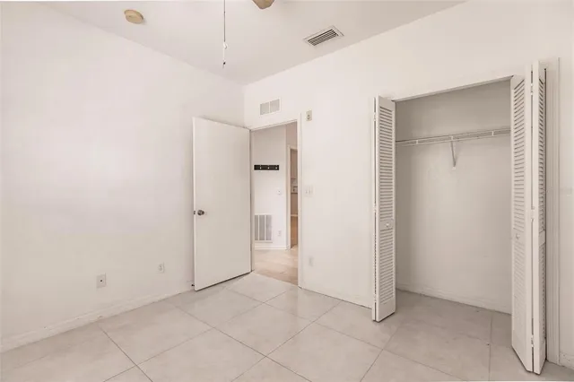 a bathroom with a toilet sink and shower