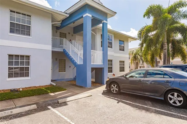a front view of a house with parking space