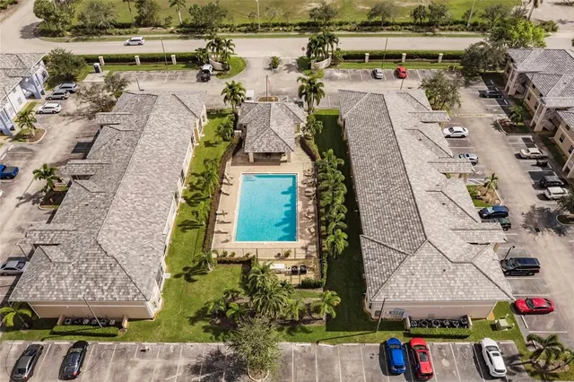 an aerial view of a house with outdoor space