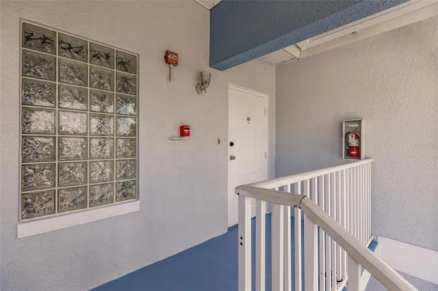 a view of entryway with wooden floor and stairs