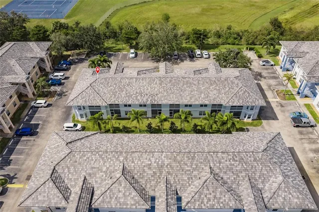an aerial view of a house with a garden