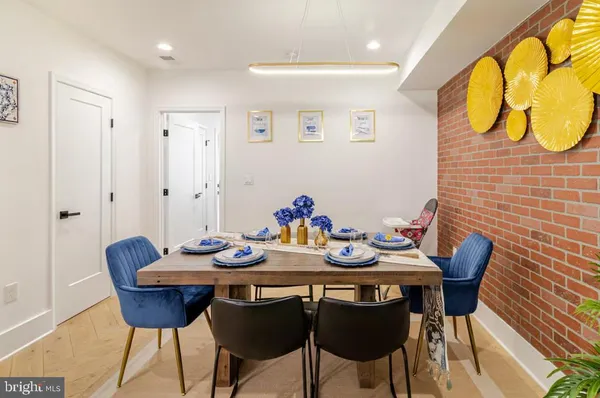 a view of a dining area with furniture and wooden floor