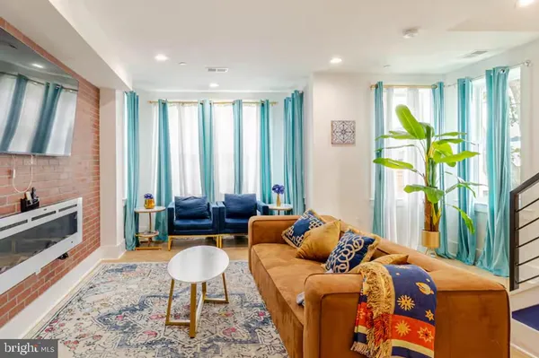 a living room with furniture and a rug