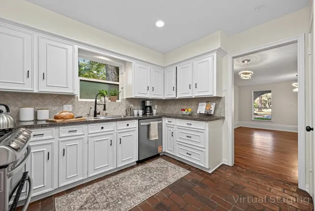 a view of an empty room with a fireplace