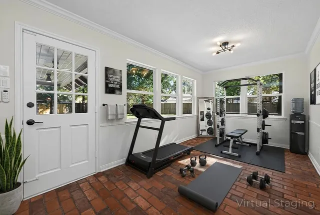 a work room with furniture and view of wooden floor
