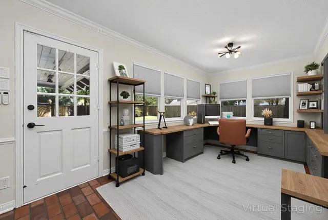 a view of an empty room with a fireplace and a window