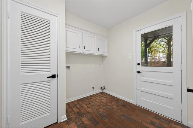 a view of a kitchen with washer and dryer