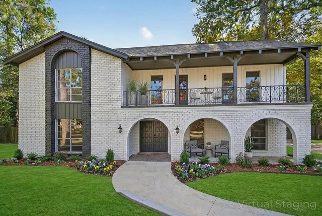 a front view of a house with garden