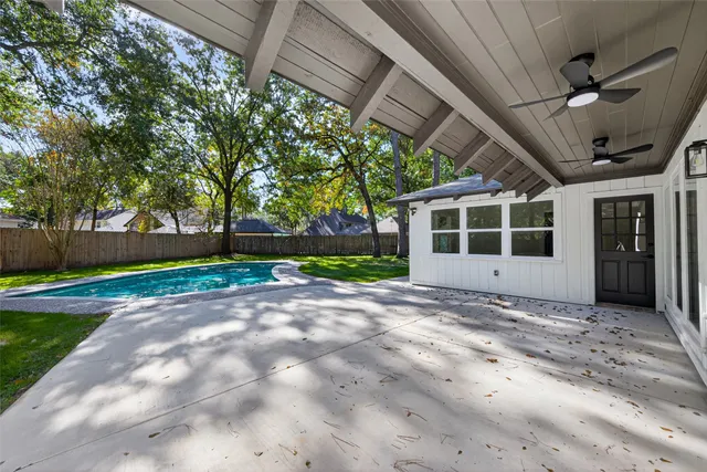 a backyard of a house with outdoor seating