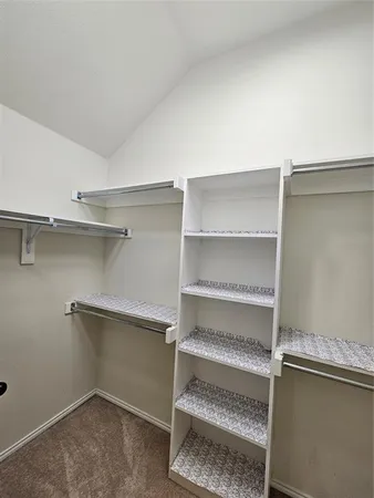 a view of room with racks on the wall