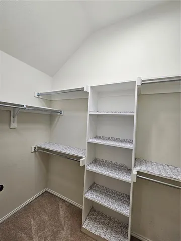 a view of room with racks on the wall