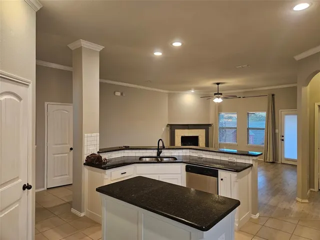 a kitchen with a sink and a refrigerator