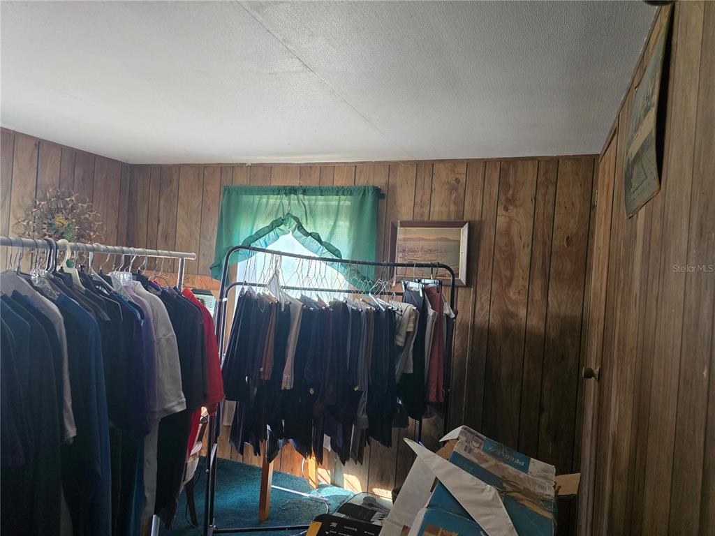 513 Smith Road Polk City, FL 33868 - Photo 13 of 33 a bed room with furniture and a window